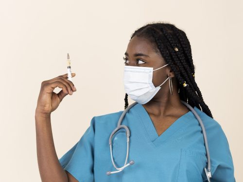 female-doctor-holding-syringe-with-vaccine